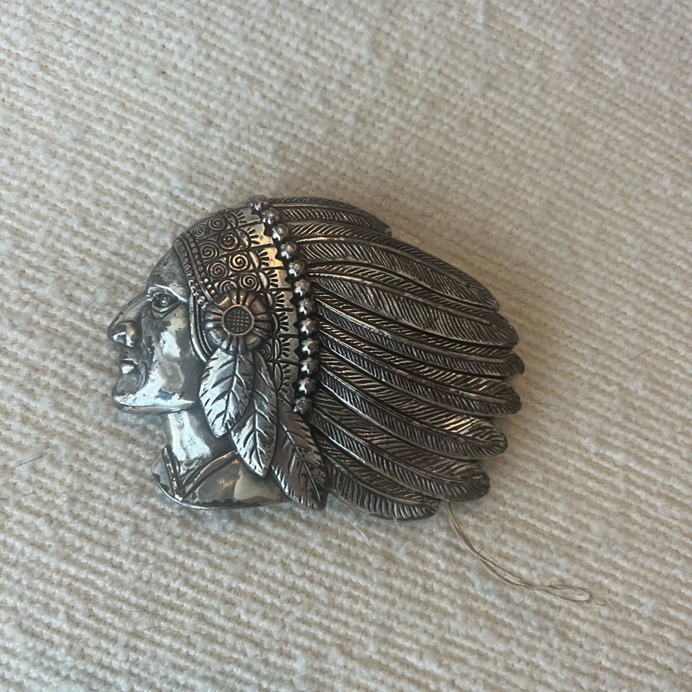 Feathered Indian belt buckle.